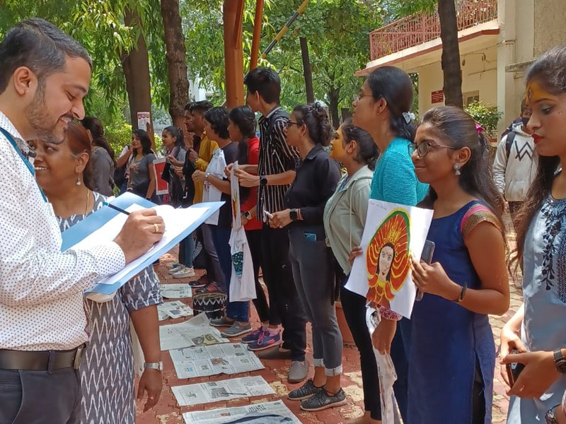 Students Participating in Durga Face Paininting Competition